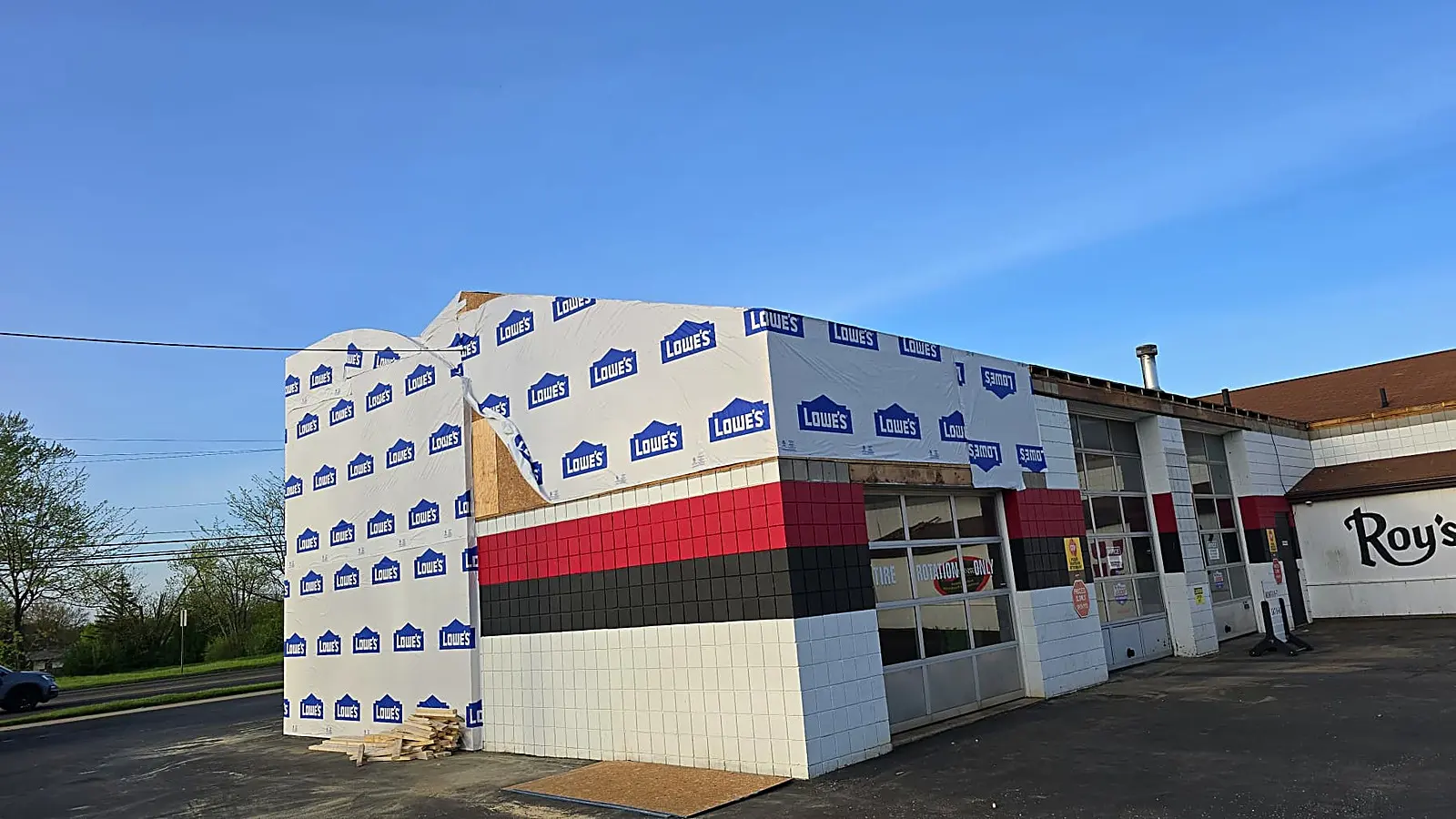 New addition in house wrap beside the original car wash building and sign, Alliance OH